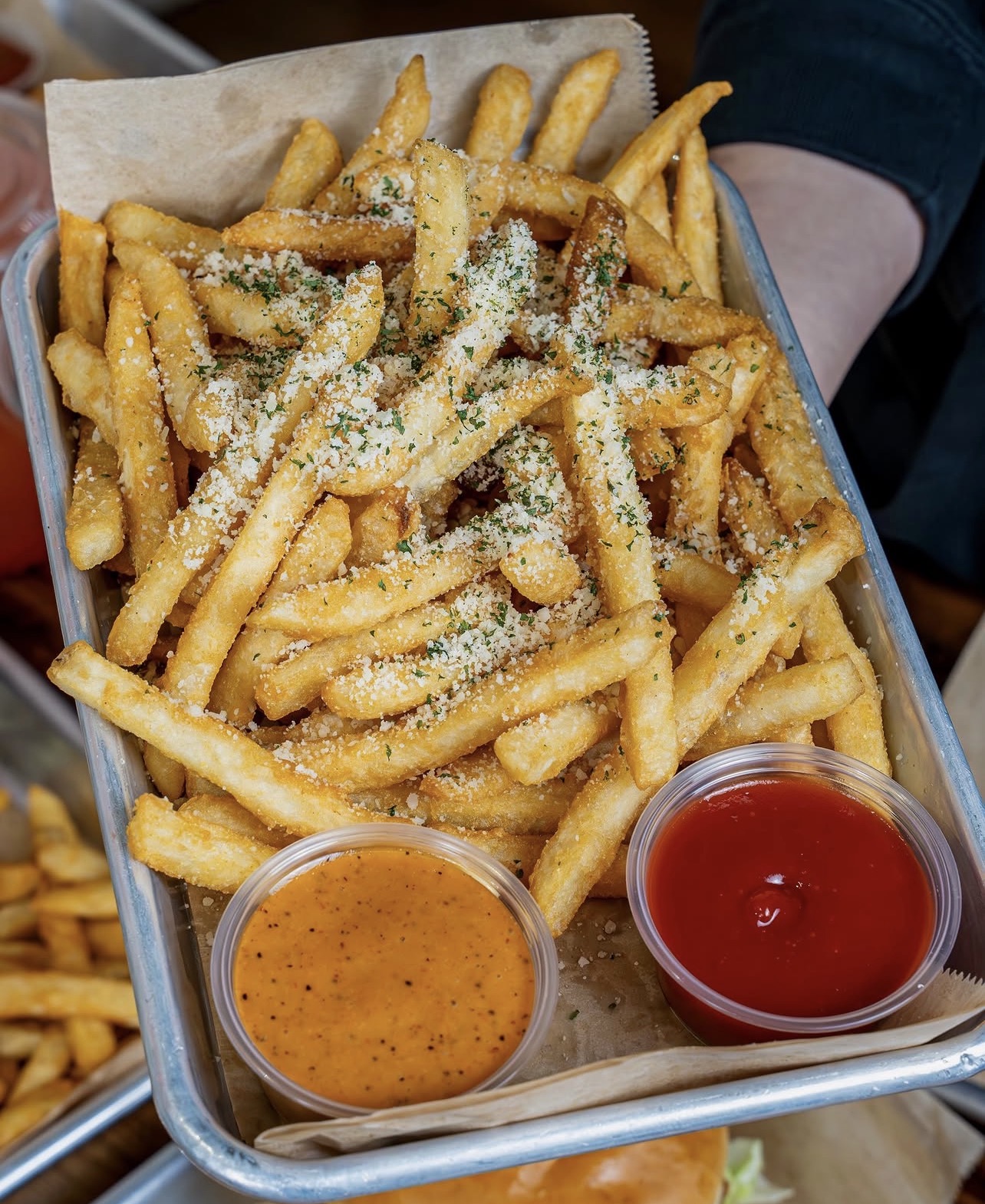 Crispy fries topped with parmesan and herbs